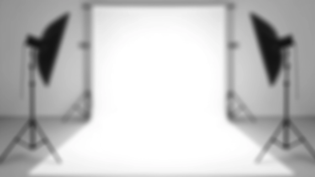 Studio lighting setup showing key light with softbox, fill light with reflector, and back light positioned around white photography backdrop